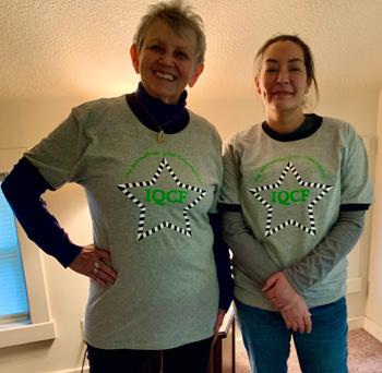 Photo of two people wearing festival T-shirts